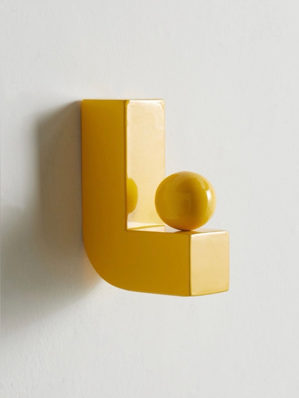 Urban Outfitters Lizzy iron wall hooks in a bright sunny yellow!  Set of 3.